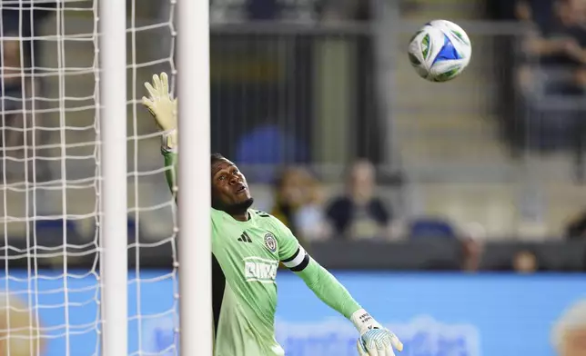 Philadelphia Union goalkeeper Andre Blake is unable to make a save on a goal by Toronto FC's Deandre Kerr in stoppage time during the second half of an MLS soccer match, Saturday, Aug. 9, 2025, in Chester, Pa. (AP Photo/Derik Hamilton)