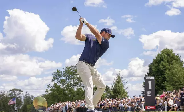 Captain Bryson DeChambeau, of Crushers GC, hits from the first tee during the final round of LIV Golf Team Championship Michigan at The Cardinal at Saint John's, Sunday, Aug. 24, 2025, in Plymouth, Mich. (Pedro Salado/LIV Golf via AP)