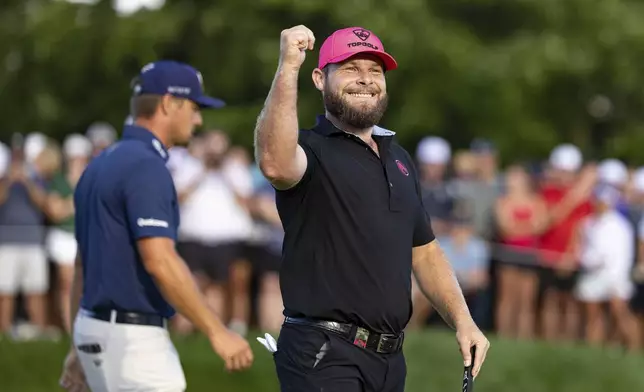 Tyrrell Hatton, of Legion XIII, reacts after his putt on the 18th green during the final round of LIV Golf Team Championship Michigan at The Cardinal at Saint John's, Sunday, Aug. 24, 2025, in Plymouth, Mich. (Scott Taetsch/LIV Golf via AP)
