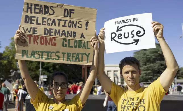 People gather in response to Greenpeace's call to support the plastics treaty on Place des Nations in front of the European headquarters of the United Nations in Geneva, Switzerland, Monday, Aug. 4, 2025 before the second segment of the fifth session of the Intergovernmental Negotiating Committee on Plastic Pollution (INC-5.2). (Salvatore Di Nolfi/Keystone via AP)