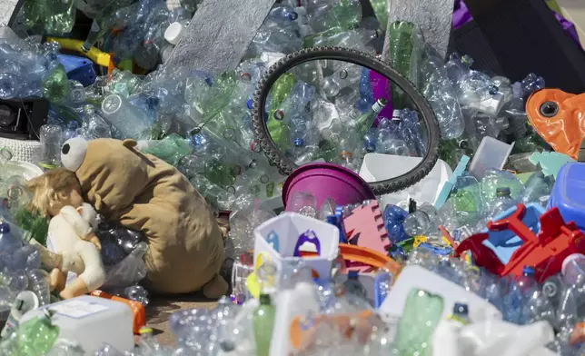 Plastic items are seen on Place des Nations in front of the European headquarters of the United Nations in Geneva, Switzerland, Monday, Aug. 4, 2025 before the second segment of the fifth session of the Intergovernmental Negotiating Committee on Plastic Pollution (INC-5.2). (Salvatore Di Nolfi/Keystone via AP)