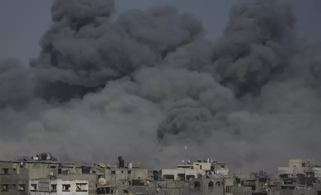 Smoke rises to the sky following an Israeli military strike in Gaza City, Sunday, Aug. 24, 2025. (AP Photo/Jehad Alshrafi)