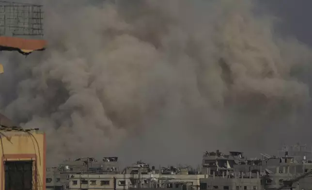 Smoke rises to the sky following an Israeli military strike in Gaza City, Sunday, Aug. 24, 2025. (AP Photo/Jehad Alshrafi)