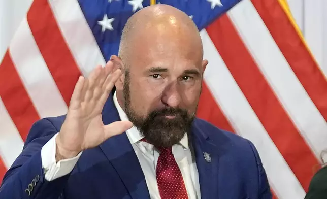 Florida Senator Jay Collins (R-District 14) waves to the crowd after being sworn in as the new Lieutenant Governor of Florida during a news conference Tuesday, Aug. 12, 2025, in Tampa, Fla. (AP Photo/Chris O'Meara)