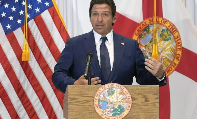 Florida Governor Ron DeSantis gestures during a news conference Tuesday, Aug. 12, 2025, in Tampa, Fla. (AP Photo/Chris O'Meara)