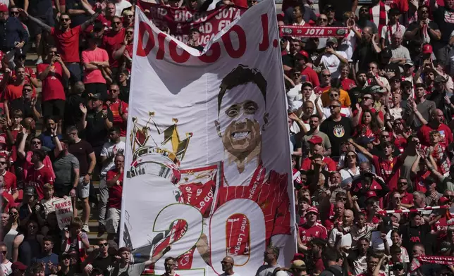 Liverpool fans hold a banner in the memory of Diogo Jota before the FA Community Shield final soccer match between Liverpool and Crystal Palace at Wembley Stadium in London,Sunday, Aug. 10, 2025. (AP Photo/Dave Shopland)