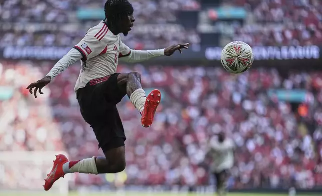 Liverpool's Jeremie Frimpong receives the ball during the FA Community Shield final soccer match between Liverpool and Crystal Palace at Wembley Stadium in London,Sunday, Aug. 10, 2025. (AP Photo/Dave Shopland)