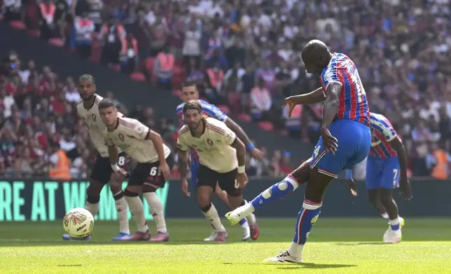 Crystal Palace's Jean-Philippe Mateta scores his side's first goal of the game from a penalty during the FA Community Shield final soccer match between Liverpool and Crystal Palace at Wembley Stadium in London,Sunday, Aug. 10, 2025(Adam Davy/PA via AP)