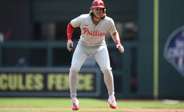 Philadelphia Phillies' Alec Bohm takes a lead from first base during the first inning of a baseball game against the Washington Nationals, Sunday, Aug. 17, 2025, in Washington. (AP Photo/Nick Wass)