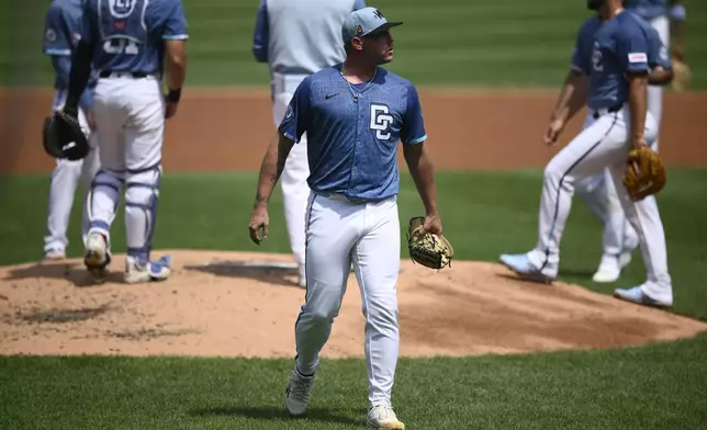 Washington Nationals starting pitcher Mitchell Parker (70) walks back to the dugout after he was pulled during the second inning of a baseball game against the Philadelphia Phillies, Sunday, Aug. 17, 2025, in Washington. (AP Photo/Nick Wass)