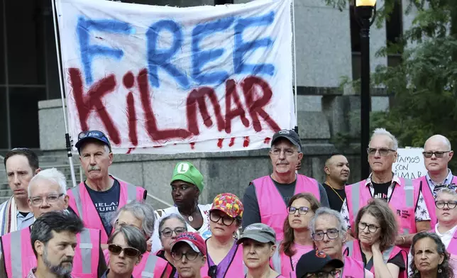 People attend a protest rally at the Immigration and Customs Enforcement field office in Baltimore, Monday, Aug. 25, 2025, to support Kilmar Abrego Garcia. (AP Photo/KT Kanazawich)