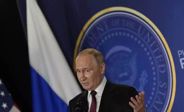 Russia's President Vladimir Putin speaks during a news conference with President Donald Trump at Joint Base Elmendorf-Richardson, Alaska, Friday, Aug. 15, 2025. (AP Photo/Julia Demaree Nikhinson)