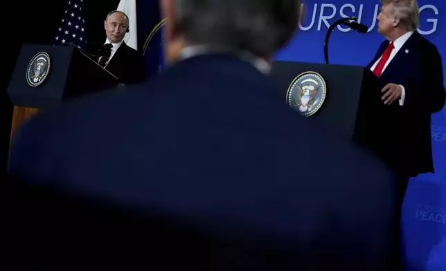 President Donald Trump listens as Russia's President Vladimir Putin speaks during a news conference at Joint Base Elmendorf- Richardson, Friday, Aug. 15, 2025, in Anchorage, Alaska. (AP Photo/Julia Demaree Nikhinson)