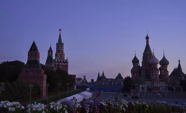The Kremlin Wall, the Spasskaya Tower, second left, empty Red Square and St. Basil's Cathedral are seen in an early morning prior to sunrise in Moscow, Russia, on Saturday, Aug. 16, 2025. (AP Photo/Alexander Zemlianichenko)