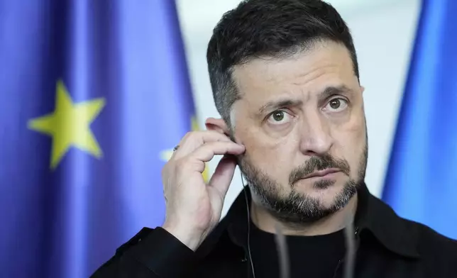 FILE - Ukrainian President Volodymyr Zelenskyy appears with German Chancellor Friedrich Merz following talks with European and U.S. leaders in Berlin, Germany, Wednesday, Aug. 13, 2025. (AP Photo/Ebrahim Noroozi, File)