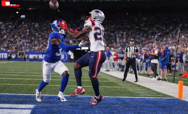 New England Patriots wide receiver Jeremiah Webb (29) makes a touchdown catch against New York Giants cornerback Dee Williams (33) during the second quarter of an NFL football game, Thursday, Aug. 21, 2025, in East Rutherford, N.J. (AP Photo/Yuki Iwamura)