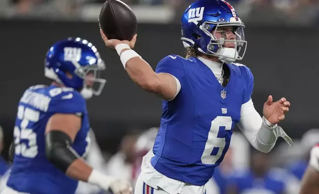 New York Giants quarterback Jaxson Dart (6) passes the ball against the New England Patriots during the first quarter of an NFL football game, Thursday, Aug. 21, 2025, in East Rutherford, N.J. (AP Photo/Frank Franklin II)