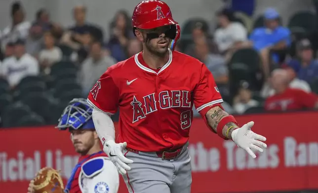Los Angeles Angels' Zach Neto (9) reacts after hitting a home run during the first inning of a baseball game against the Texas Rangers, Monday, Aug. 25, 2025, in Arlington, Texas. (AP Photo/LM Otero)