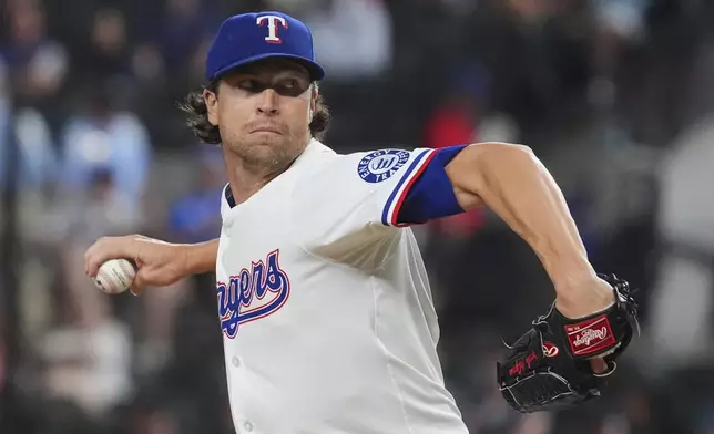 Texas Rangers starting pitcher Jacob deGrom throws during the first inning of a baseball game against the Los Angeles Angels, Monday, Aug. 25, 2025, in Arlington, Texas. (AP Photo/LM Otero)