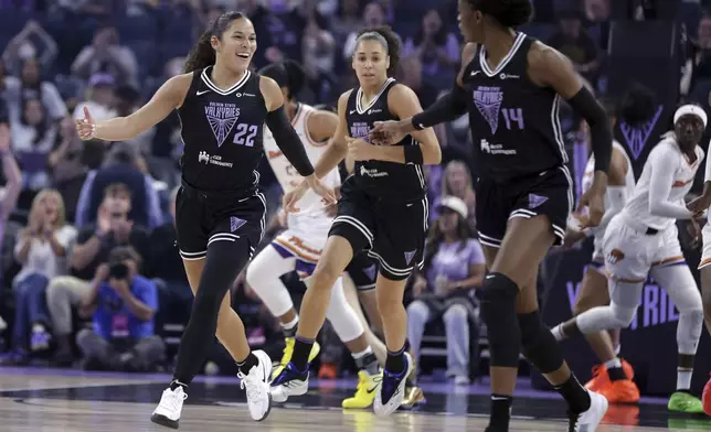 Golden State Valkyries' Veronica Burton (22) celebrates a basket with Temi Fagbenle (14) against the Phoenix Mercury during the first half of a WNBA basketball game in San Francisco on Tuesday, Aug. 19, 2025. (Scott Strazzante/San Francisco Chronicle via AP)