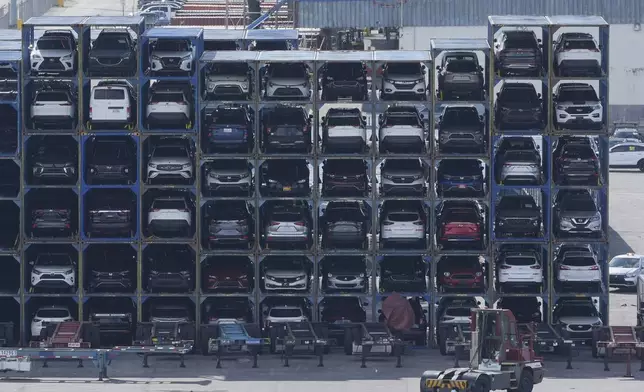 New cars are stacked for delivery after arriving at PortMiami Thursday, Aug. 7, 2025, in Miami. (AP Photo/Marta Lavandier)