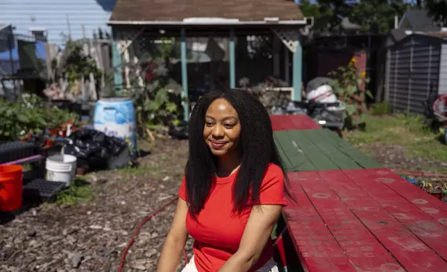 Alicia White, president and founder of the Project Petals, poses outside Paradise Community Garden, Friday, Aug. 8, 2025, in Inwood, N.Y. (AP Photo/Yuki Iwamura)