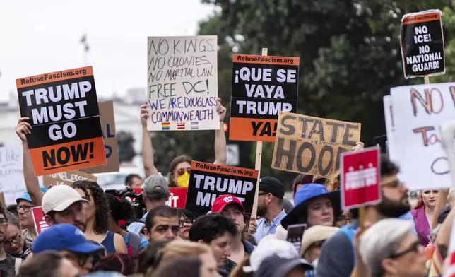 Protesters demonstrate against President Donald Trump's planned use of federal law enforcement and National Guard troops in Washington, during a rally in front of the White House, Monday, Aug. 11, 2025, in Washington. (AP Photo/Julia Demaree Nikhinson)