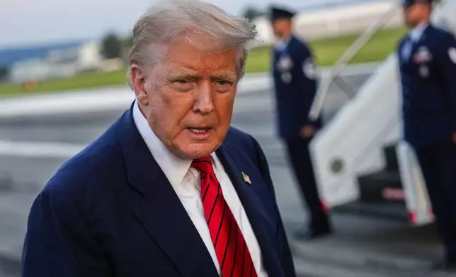 President Donald Trump speaks with reporters before boarding Air Force One at Lehigh Valley International Airport, Sunday, Aug. 3, 2025, in Allentown, Pa. (AP Photo/Julia Demaree Nikhinson)