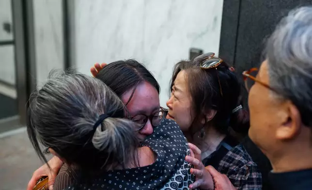 Yeonsoo Go, a Purdue student who was detained by immigration authorities in Manhattan last week, is embraced by her mother after being released from custody, Monday, Aug. 4, 2025, in New York. (AP Photo/Olga Fedorova)