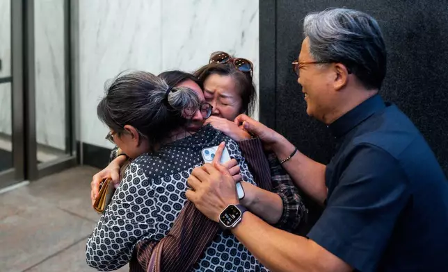 Yeonsoo Go, a Purdue student who was detained by immigration authorities in Manhattan last week, embraces her mother after being released from immigration custody, Monday, Aug. 4, 2025, in New York. (AP Photo/Olga Fedorova)