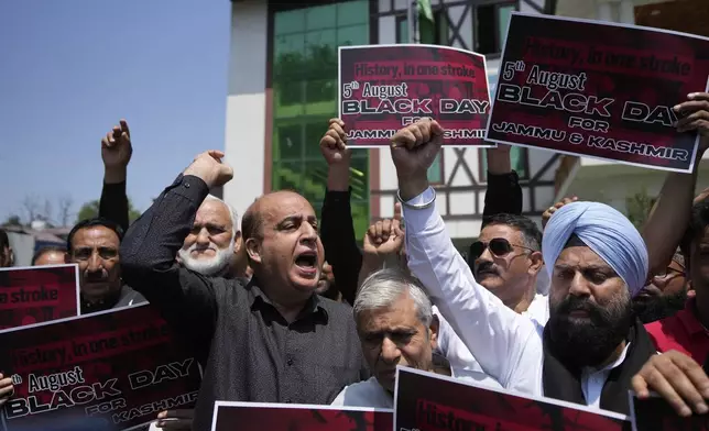 Supporters of India's opposition Congress party shout slogans demanding the ruling government restore the statehood of the disputed region, in Srinagar, Indian-controlled Kashmir, Tuesday, Aug 5, 2025. (AP Photo/Mukhtar Khan)