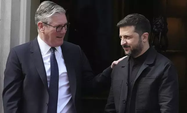 FILE - Britain's Prime Minister Keir Starmer and Ukraine's President Volodymyr Zelenskyy leave 10 Downing Street after a meeting in London on June 23, 2025. (AP Photo/Frank Augstein, File)