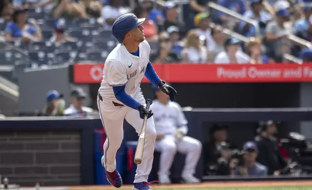 Toronto Blue Jays' Myles Straw (3) hits a home run against the Texas Rangers during the second inning of a baseball game in Toronto, Saturday, Aug. 16, 2025. (Tara Walton/The Canadian Press via AP)