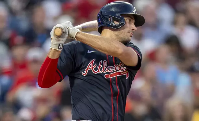 Atlanta Braves' Matt Olson hits a double scoring Jurickson Profar during the sixth inning of a baseball game against the Philadelphia Phillies, Saturday, Aug. 30, 2025, in Philadelphia. (AP Photo/Chris Szagola)