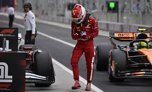 Ferrari driver Charles Leclerc of Monaco celebrates his pole position after the qualifying session for the Hungarian Formula One Grand Prix at the Hungaroring racetrack in Mogyorod, Hungary, Saturday, Aug. 2, 2025. (AP Photo/Denes Erdos)
