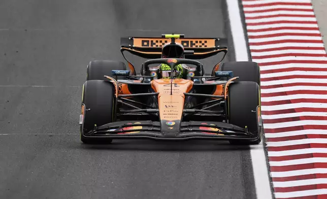 McLaren driver Lando Norris of Britain steers his car during the Hungarian Formula One Grand Prix race at the Hungaroring racetrack in Mogyorod, Hungary, Sunday, Aug. 3, 2025. (AP Photo/Denes Erdos)