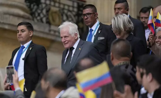 Miguel Uribe Londono, father of slain presidential candidate Miguel Uribe Turbay, arrives to read a statement to officially announce his bid for the presidency in Bogota, Colombia, Tuesday, Aug. 26, 2025. (AP Photo/Fernando Vergara)