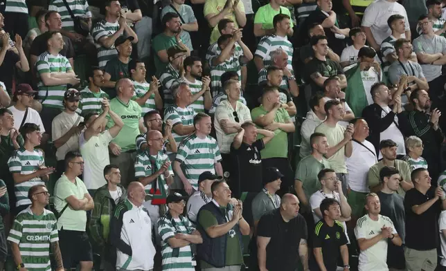 Celtic fans react during the extra time of the Champions League playoff second leg soccer match between Kairat and Celtic at Ortalyk stadium in Almaty, Kazakhstan, Wednesday, Aug. 27, 2025. (AP Photo/Alikhan Sariyev)