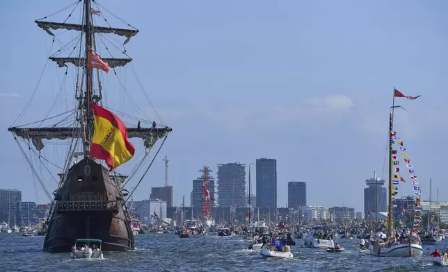 Hundreds of tall ships sailed into the Dutch capital's harbor for the 10th edition of SAIL, in Amsterdam, Netherlands, Wednesday, Aug. 20, 2025. (AP Photo/Peter Dejong)
