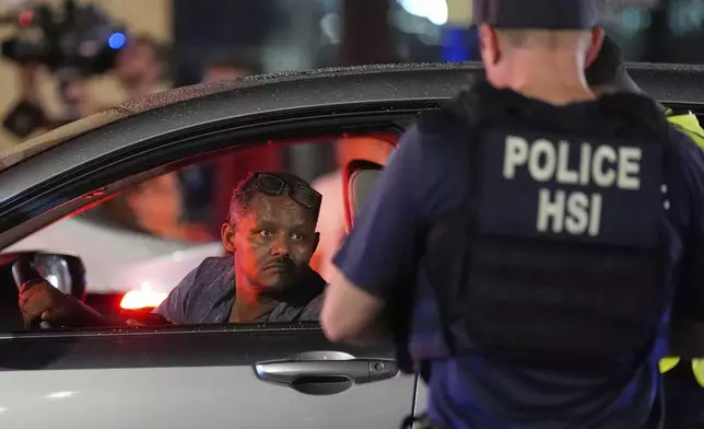 Department of Homeland Security Investigations agents join Washington Metropolitan Police Department officers as they conduct traffic checks at a checkpoint along 14th Street in northwest Washington, Wednesday, Aug. 13, 2025, in Washington. (AP Photo/Alex Brandon)