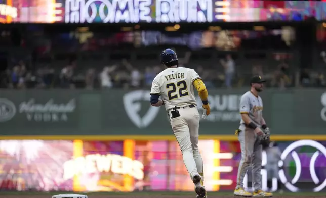 Milwaukee Brewers' Christian Yelich rounds the bases after hitting a solo home run during the third inning of a baseball game against the Pittsburgh Pirates, Monday, Aug. 11, 2025, in Milwaukee. (AP Photo/Aaron Gash)