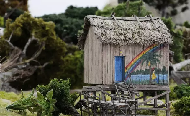 A miniature home made to look like it is in Mairinque, Brazil, is constructed at a workshop in Pilar, Argentina, Wednesday, June 25, 2025. (AP Photo/Natacha Pisarenko)