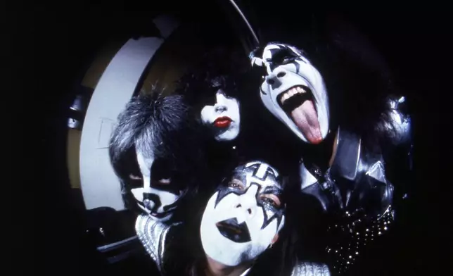 FILE - Members of the rock group KISS; Gene Simmons, clockwise from right, Ace Frehley, Peter Criss and Paul Stanley are photographed before a concert in Hartford, Conn.,on Feb. 16, 1977. (AP Photo/Richard Drew, File)