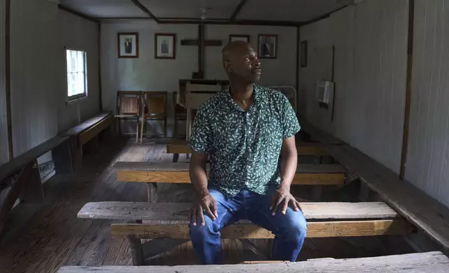 Eric Crawford, author of "Gullah Spirituals: The Sound of Freedom and Protest in the South Carolina Sea Islands," poses for a photo at the Mary Jenkins Praise House in St. Helena Island, Sunday, July 20, 2025. (AP Photo/Luis Andres Henao)