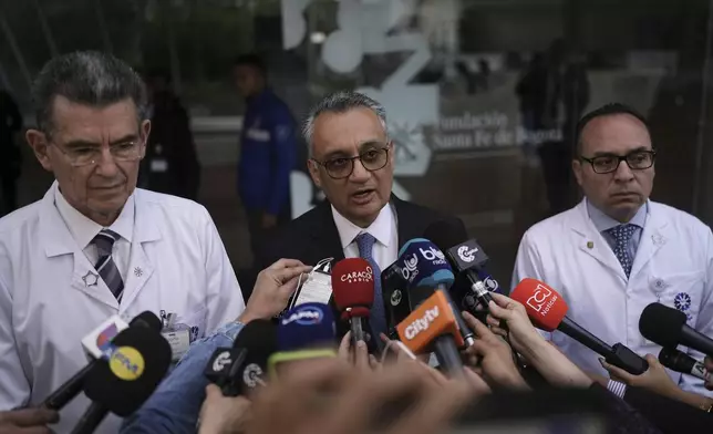 Dr. Henry Gallardo announces the death of opposition Sen. Miguel Uribe at the clinic where he had been hospitalized for more than two months after being shot during a campaign rally in Bogota, Colombia, Monday, Aug. 11, 2025. (AP Photo/Ivan Valencia)