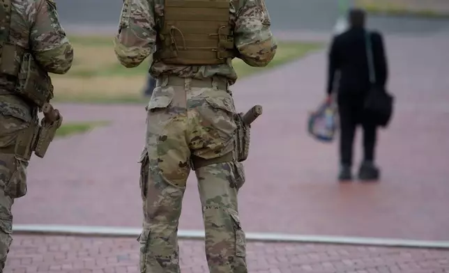 Armed members of the South Carolina National Guard are positioned outside of Union Station in Washington, Sunday, Aug. 24, 2025. (AP Photo/Rod Lamkey, Jr.)