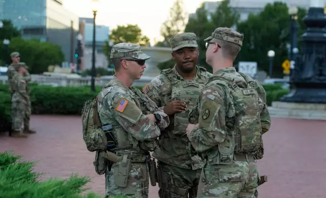 Armed members of the South Carolina National Guard are positioned outside of Union Station in Washington, Sunday, Aug. 24, 2025. (AP Photo/Rod Lamkey, Jr.)