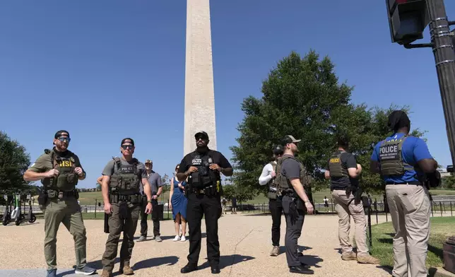 Homeland Security Investigations (HSI) agents patrol the National Mall, Saturday, Aug. 23, 2025, in Washington. (AP Photo/Jose Luis Magana)