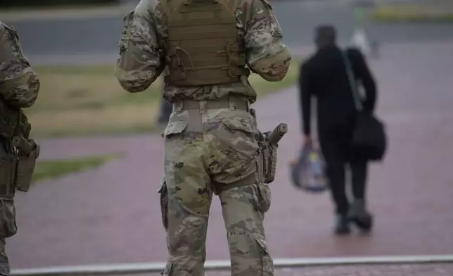 Armed members of the South Carolina National Guard are positioned outside of Union Station in Washington, Sunday, Aug. 24, 2025. (AP Photo/Rod Lamkey, Jr.)