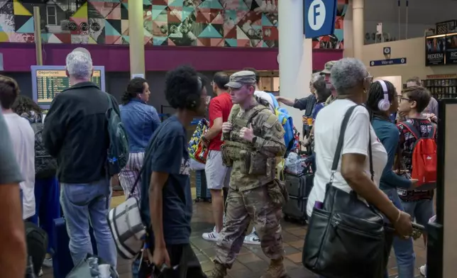 Members of the South Carolina National Guard patrol the Amtrak area of Union Station in Washington, Sunday, Aug. 24, 2025. (AP Photo/Rod Lamkey, Jr.)